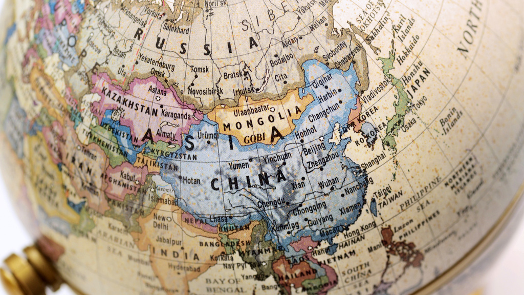 Closeup of a globe focusing on the countries of China, Japan, and the far east.